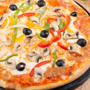 Delicious vegetable pizza topped with mushrooms, olives, and vibrant peppers.